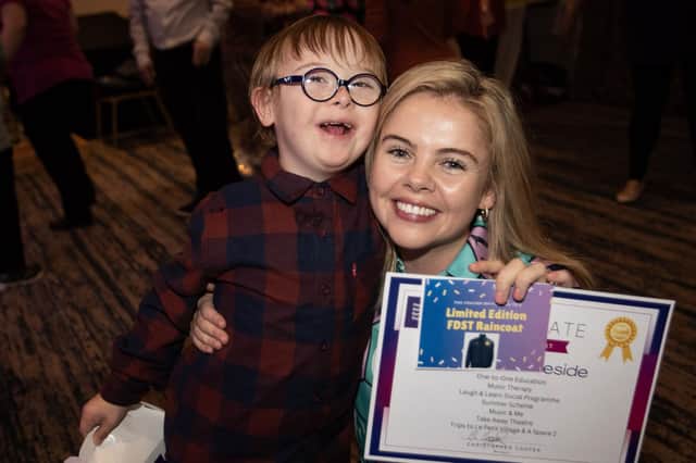 Smiles all round from Myles as he receives his gift from special guest speaker and Derry Girls star Saoirse Monica Jackson on Tuesday evening.