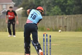 Newbuildings batsman Hanu Viljoen is bowled by Strabane's Nasir Nawaz.