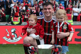 Philip Lowry celebrates winning the Irish Cup with his family