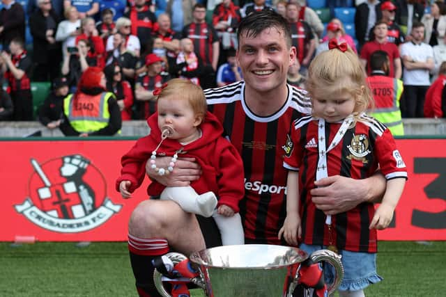 Philip Lowry celebrates winning the Irish Cup with his family