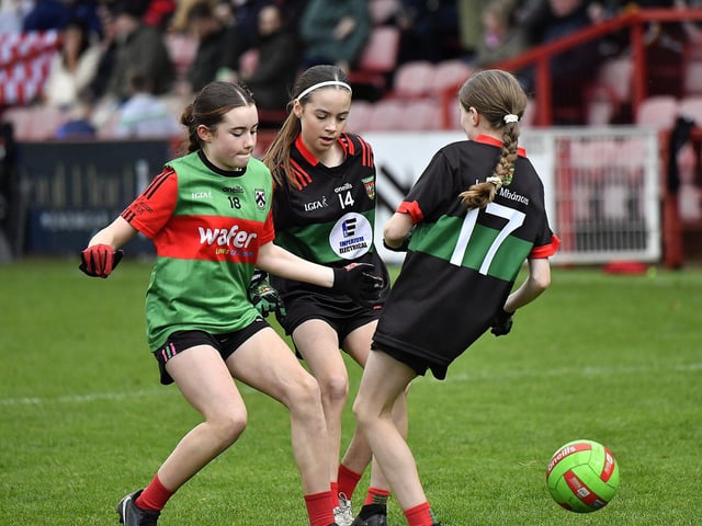 Young footballers from Doire Trasna and Slaughtmanus Under 12 teams play at half-time at the Derry Junior Football Championship Final held in Celtic Park on Sunday afternoon. Photo: George Sweeney