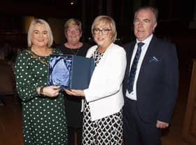 The Mayor, Sandra Duffy making a special presentation to former Hollybush PS Principal Carmel Dunn on her retirement from the school and to mark her overall contribution to education at a function in her honour at the Guildhall on Wednesday evening. Included is Councillor Angela Dobbins and Carmel’s husband Eugene.