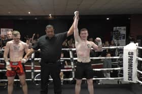 Derry fighter Conal McBrearty has his hand raised in victory after his British title fight against Englishman Brandon Wood (British Combat Academy).
