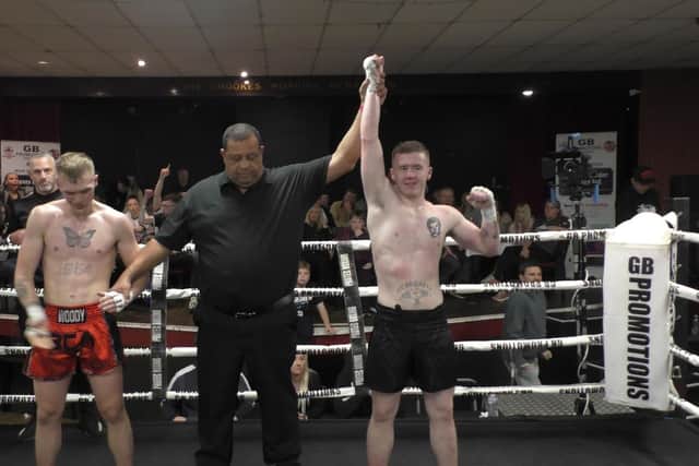 Derry fighter Conal McBrearty has his hand raised in victory after his British title fight against Englishman Brandon Wood (British Combat Academy).