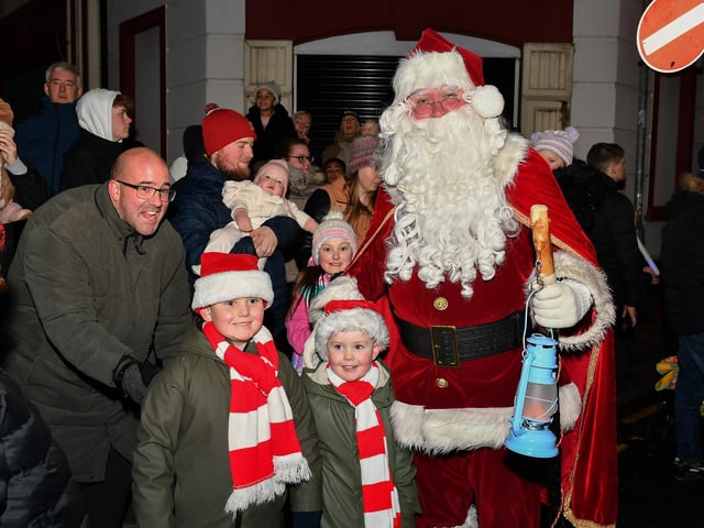 Santa greets children at the Derry Magical Christmas procession on Friday evening. Photo: George Sweeney