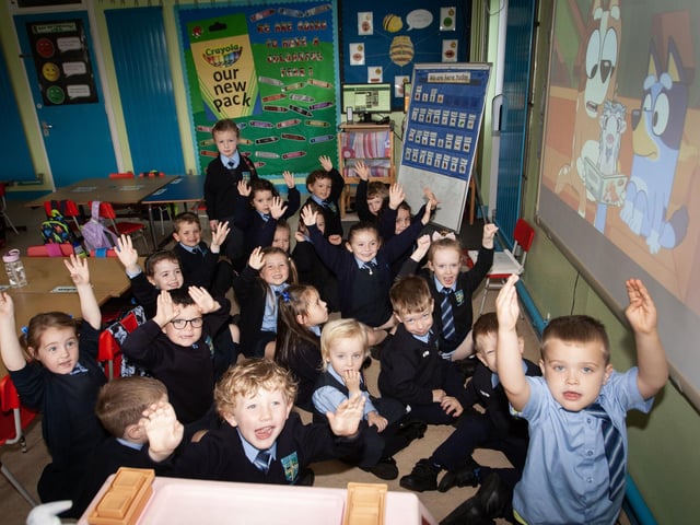 CARTOON-TIME. . . .Too wet for these P1 pupils at Hollybush PS last week to go outside so some cartoon fun in the big screen instead.