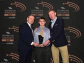 Doire Colmcille's Oisín Barr with Ciaran McLaughlin, Ulster GAA President, and Damian Bannon, Translink Belfast Area Manager at the award ceremony in Belfast recently. (Photo: John Merry)