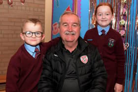 Martin Dunne with Shea and Erin at St John’s PS Grandparents Vintage Tea. Photo: George Sweeney