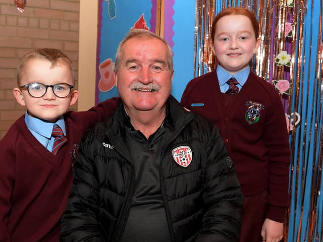 Martin Dunne with Shea and Erin at St John’s PS Grandparents Vintage Tea. Photo: George Sweeney