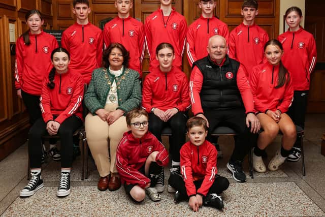Civic Reception to commemorate 50th anniversary of the Tristar F.C.: The Mayor of Derry and Strabane, Councillor Patricia Logue with Shaun Condren, club chairman, with current players who attended the reception. ©Lorcan Doherty
