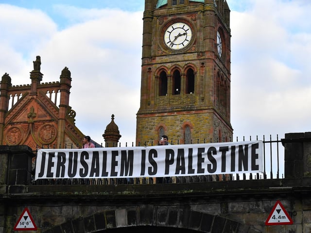 Banner draped over Shipquay Gate during the pro-Palestinian solidarity march on Saturday afternoon. Photo: George Sweeney