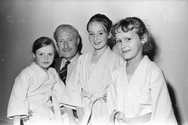 Brian Morton, chair Derry Development Commission, with three young members of Eglinton Judo Club, from left, Jackie Burns, Angela Savage and Belinda Kie, at the opening of the new St. Columb's Park Activity Centre.