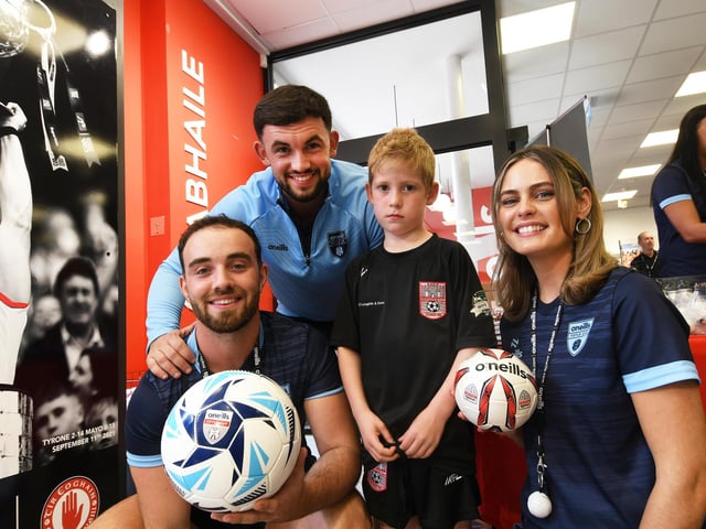 O'Neills staff members Jack O'Donnell, Charlie White and Jo Duffy pictured with one of the youngsters who visited the O'Neills Superstore on Tuesday.