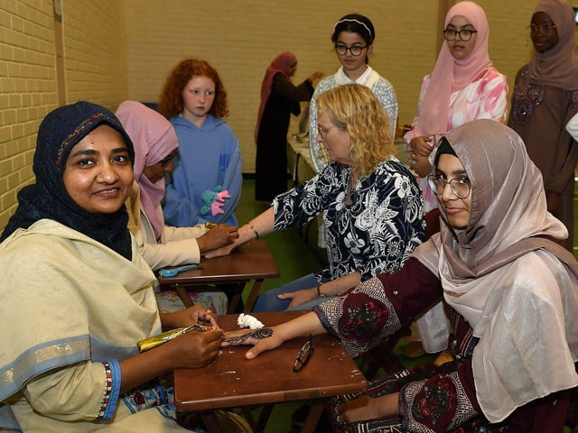 Henna artists at the North West Islamic Association’s celebration of Eid Mubarak held in Templemore Sport’s Complex. Photo: George Sweeney
