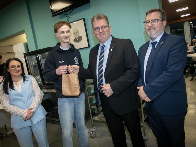Aaron O'Dooherty, Head Boy pictured making a special presentation to Head of Year Mr. Donal Chambers on Thursday night. Included in photo is Mrs. Caroline McLaughlin, Principal and Mr. John Johnston, Vice Principal. (Photos; Jim McCafferty Photography) : .