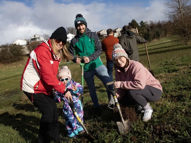Having fun at Saturday's DCSDC Special Tree Planting at Bay Road Park are the Quinn family Siobhan, Holly (2) and Sarah. Back centre is Christopher Fagan.