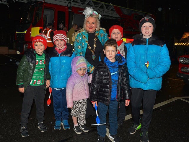 Mayor Sandra Duffy with members of the Duffy, Cregan and McLaughlin families at the Derry Christmas procession on Sunday evening last. Photo: George Sweeney. DER2248GS - 11