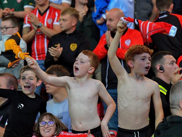 Fans celebrate Derry City’s win over KuPs at the Brandywell. Photo: George Sweeney.DER2330GS -