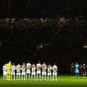 The two teams observe a minute's silence prior to the UEFA Champions League group F match between Celtic FC and RB Leipzig at Celtic Park on October 11, 2022 in Glasgow, Scotland. (Photo by Stu Forster/Getty Images)