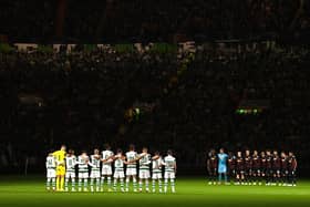 The two teams observe a minute's silence prior to the UEFA Champions League group F match between Celtic FC and RB Leipzig at Celtic Park on October 11, 2022 in Glasgow, Scotland. (Photo by Stu Forster/Getty Images)