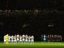 The two teams observe a minute's silence prior to the UEFA Champions League group F match between Celtic FC and RB Leipzig at Celtic Park on October 11, 2022 in Glasgow, Scotland. (Photo by Stu Forster/Getty Images)