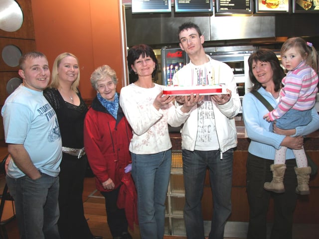 Daryl receives his birthday cake from his mum Monica as he celebrates huis 21st birthday at the Bowling Alley 0056JML : Daryl Harrigan celebrating his birthday.