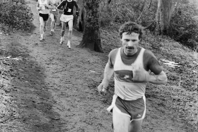 These runners make their way through a muddy trail at the Ulster Cross Country Championships at St Columb's Park in Derry 40 years.