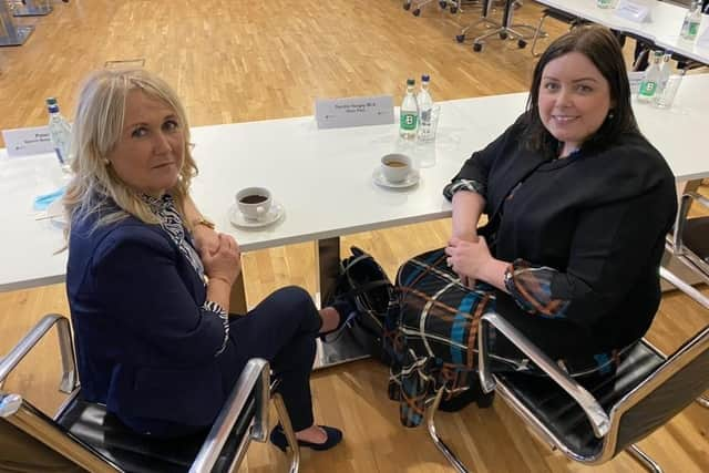 Ciara Ferguson pictured previously with former Communities Minister Deirdre Hargey, who has also criticised the cuts imposed on her former department and the impact this will have on local people.