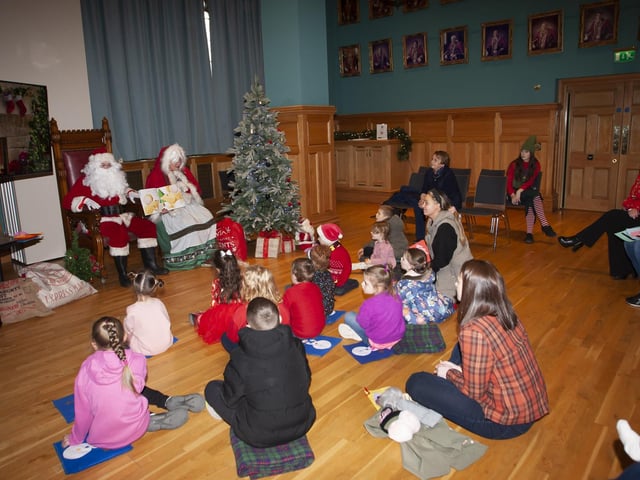 Stories with Santa and Mrs. Claus during Saturday's 'Mayor's Magical Christmas Experience' in the Guildhall.:Mayor's Christmas initiative at the Guildhall