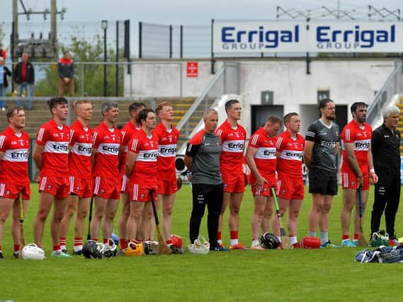 Derry senior hurling manager Johnny McGarvey stands alongside his players. Photo: George Sweeney. DER2320GS – 150