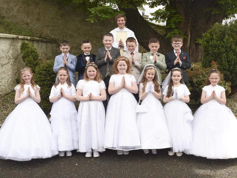 Some of the P4 Class with Fr Roland Colhoun, having received “Second Holy Communion”, the day after First Communion. Sunday Mass, 5th May 2024 at St Eugene’s Church, Glenock, Newtownstewart.