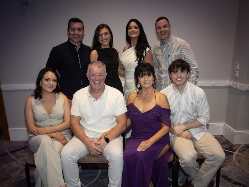 Mrs. Margaret Ross, retiring teacher, St. Joseph's Boys School pictured with her husbanad James and family at Friday's retirement function in the Everglades Hotel, Derry. (Photos: Jim McCafferty Photography)
