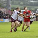 Galway players converge on Derry’s Ethan Doherty. Photo:  George Sweeney