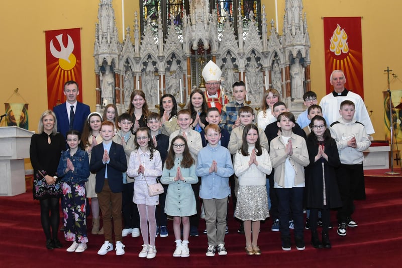 Pupils from Good Shepherd Primary School, Waterside, Derry who received the Sacrament of Confirmation from Most Rev. Donal McKeown, Bishop of Derry, on Friday afternoon last. Included in photo are from left, Mrs. Suzann McCafferty, Principal, Mr. Herron, P7 Teacher, and on right, Fr. Michael Canny, Monsignor General. (Photos: Jim McCafferty Photography)