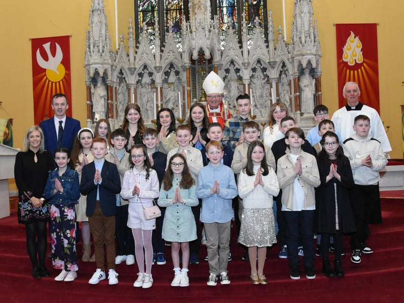 Pupils from Good Shepherd Primary School, Waterside, Derry who received the Sacrament of Confirmation from Most Rev. Donal McKeown, Bishop of Derry, on Friday afternoon last. Included in photo are from left, Mrs. Suzann McCafferty, Principal, Mr. Herron, P7 Teacher, and on right, Fr. Michael Canny, Monsignor General. (Photos: Jim McCafferty Photography)