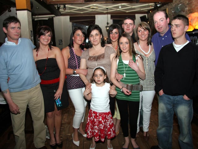 Emma and Elaine enjoy their 18th birthday party with family members at Jackie Mullans 0094JML : Parties and celebrations April 2006: Emma & Elaine's 18th.