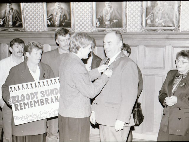 Mayor Kerr with Bloody Sunday relatives at the launch of the Bloody Sunday black ribbon.
