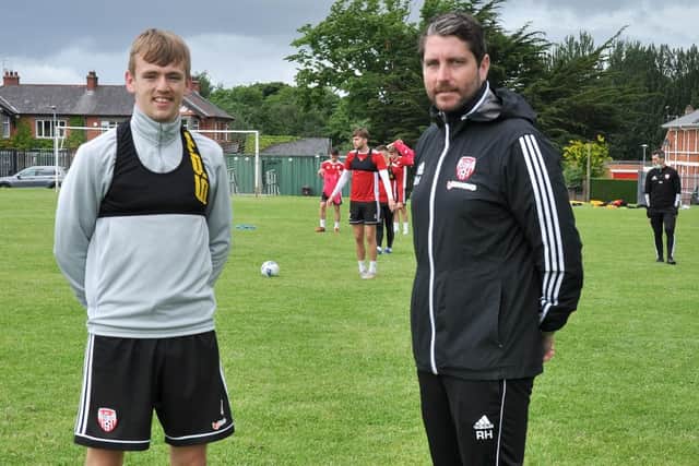 Ciaron Harkin, pictured with Ruaidhri Higgins has signed a new deal with the club.
