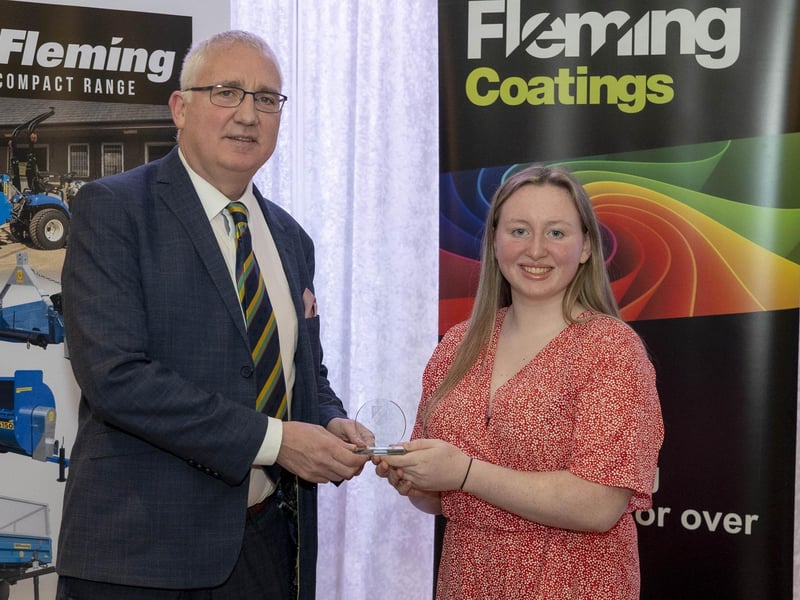 Jenni Jackson of Eglinton receives Women's Premiership Bowling Award from Brian Dougherty at the NW Cricket presentation evening.