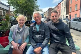 Paul Weller with Eamon Friel's widow Caitlín and his son Colum after stopping for a coffee at Jerusalem - Palestinian Bakery and Coffee House on Wednesday.