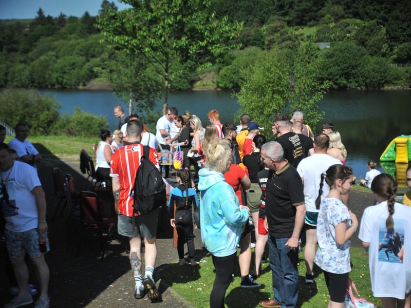 People taking the plunge in Creggan Country Park during a family fun day to celebrate the lives of people who have died by suicide.