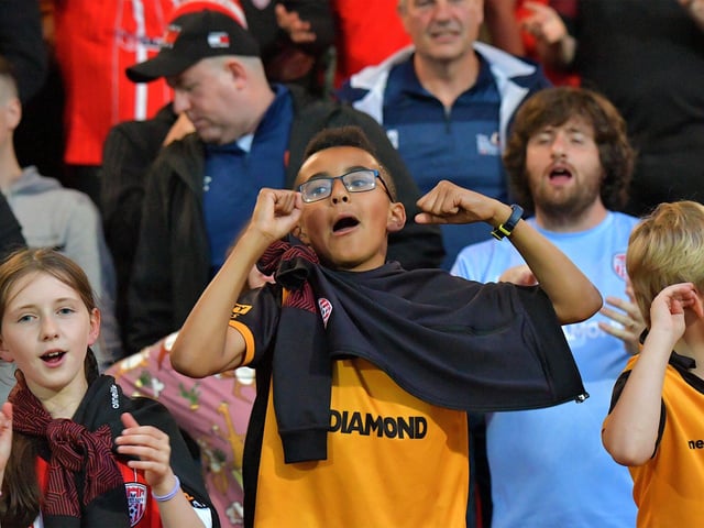 Fans celebrate Derry City’s win over KuPs at the Brandywell. Photo: George Sweeney. DER2330GS -