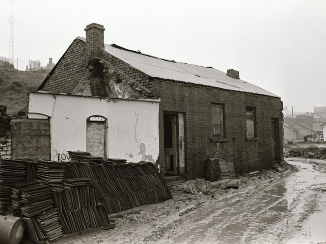 One of the last remaining older dwellings in the Bogside beneath the shadow of Derry's Walls.