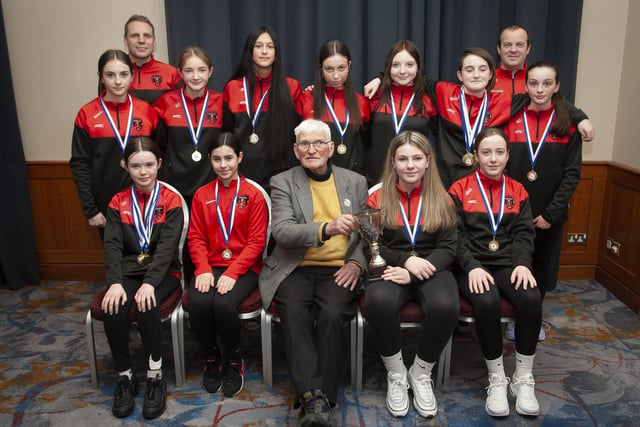 John ‘Jobby’ Crossan pictured with the Phoenix Flames U13 team, winners of the Winter Cup, during the Annual Awards in the City Hotel on Friday night last. Included are coaches Ben Jackson and Paul Doran.