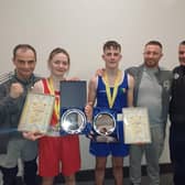 Oakleaf coaches Eugene 'Budge' O'Kane, Aaron Rogan and Christy Doherty pictured with newly crowned Ulster Elite champions, Carleigh Irving and Jack Harkin.