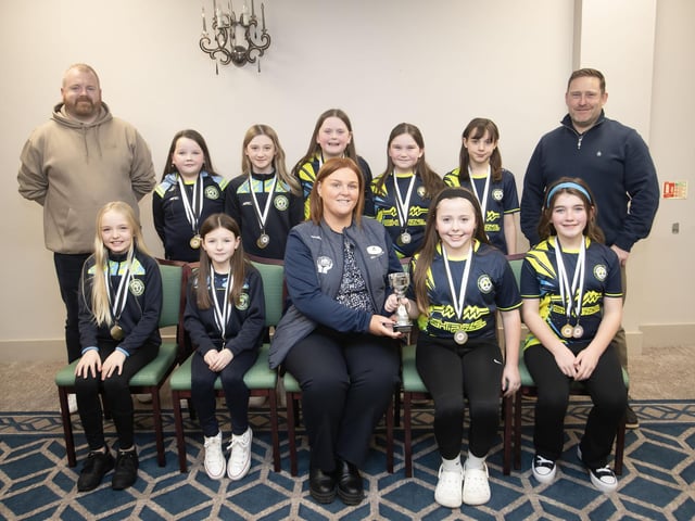 Sion Ladies u-11s receive the Winter Plate from Kerri Pyne at the D&D Youth FA awards at the Waterfoot Hotel on Sunday night last. Included are coaches Conor Maxwell and Dan McCrory.. (Photos: Jim McCafferty Photography)