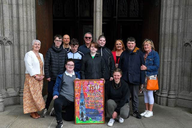 Pupils and staff from Ardnashee School and College pictured at St Eugene’s Cathedral recently with an artwork they created for the cathedral’s 150th anniversary. The art work is made up of 42 7x8cm rectangles that pupils used a pointillism technique with their fingers and cotton wool buds. Included in the photograph are Therese Ferry, Diocesan Advisor, on the right, Adrian Newton, art project leader, third from right, and Anne Marie Hickey, Pastoral Co-ordinator, third from left. Photo: George Sweeney.  DER2320GS – 51