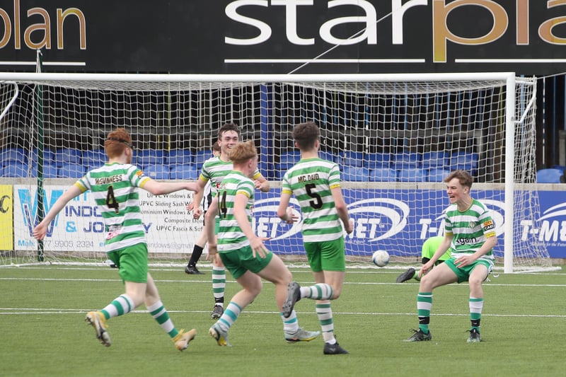Top Of The Hill Celtic players run to celebrate with Christian Porteous after his late goal sealed their 3-1 win over St. Oliver Plunkett.