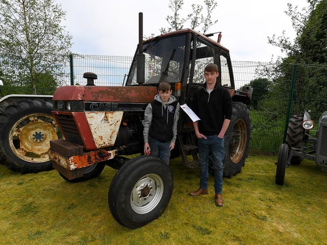 Brothers Daniel and Thomas Lynch pictured alongside their Case 1394 tractor at the Muff Vintage Show, held in the Community Park on Sunday. Photo: George Sweeney.