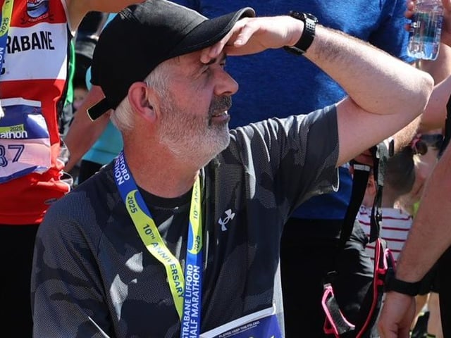 Finn Harps coach Tommy Canning lends his support after finishing the Strabane Lifford Half Marathon.